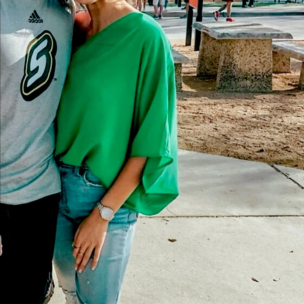 One shoulder green top